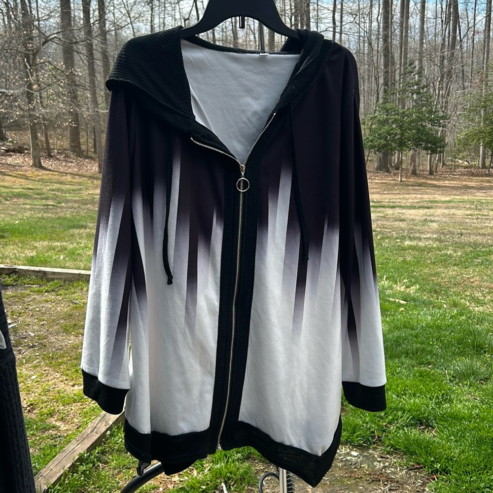 No brand name black and white hooded jacket with jagged hem